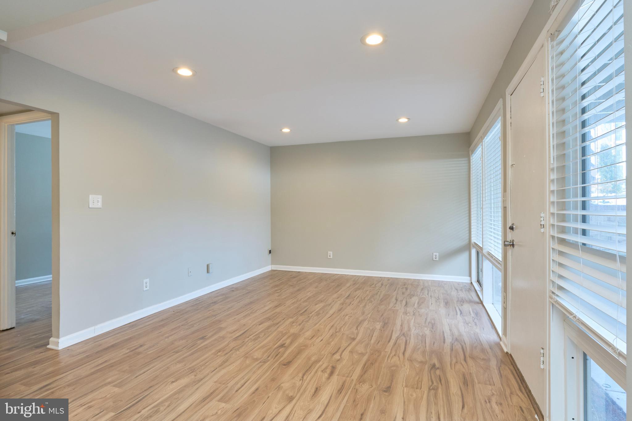 156 Haycock Road, Unit A6 Falls Church, VA 22046 - Photo 6 of 32 wooden floor in an empty room with a window