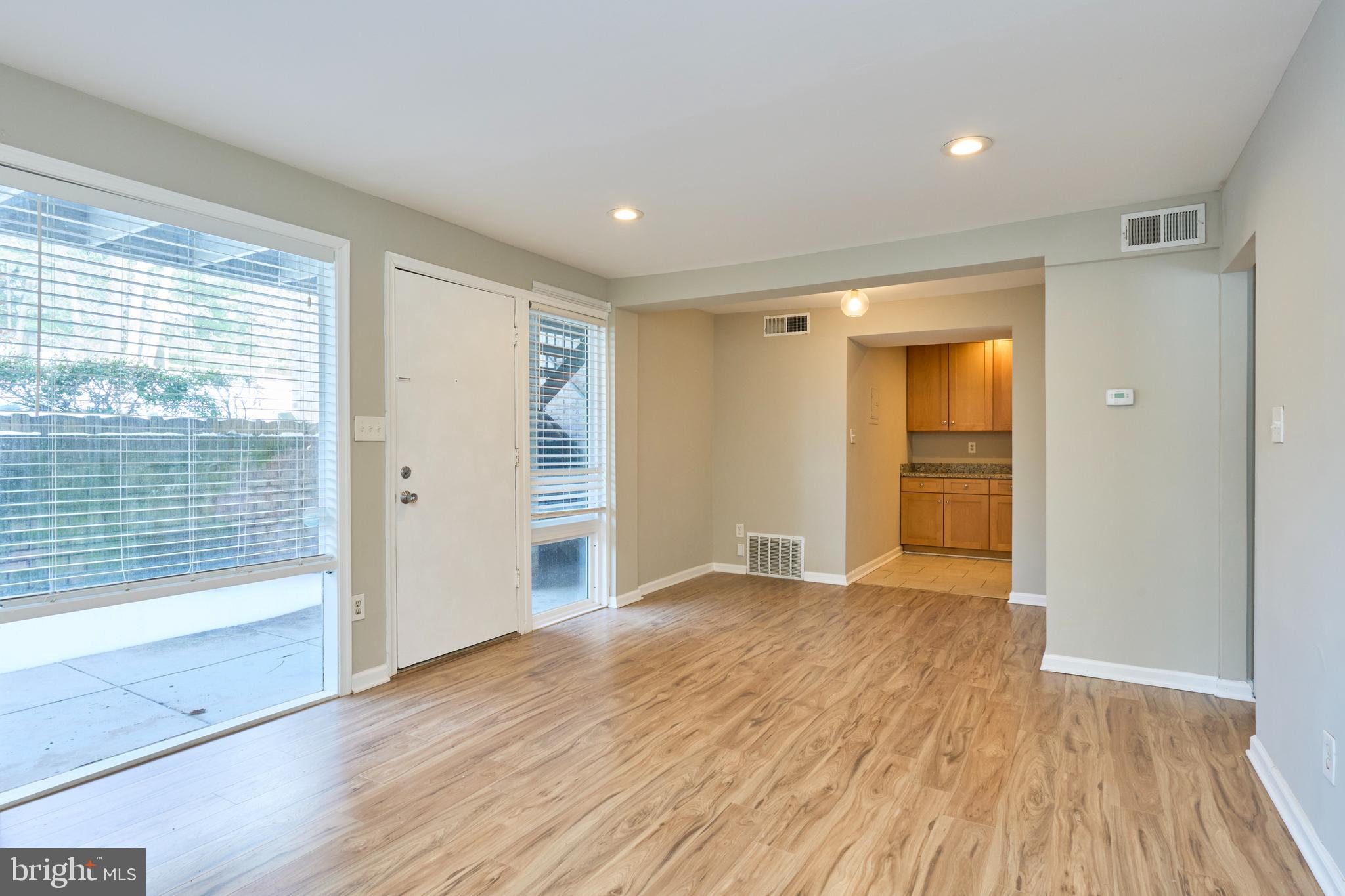 156 Haycock Road, Unit A6 Falls Church, VA 22046 - Photo 7 of 32 wooden floor in an empty room with a window