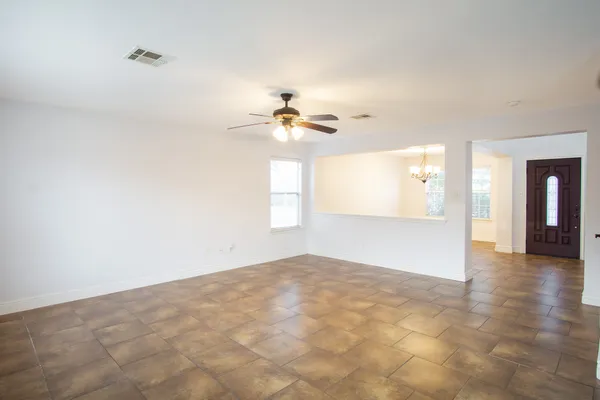 a view of an empty room with a window