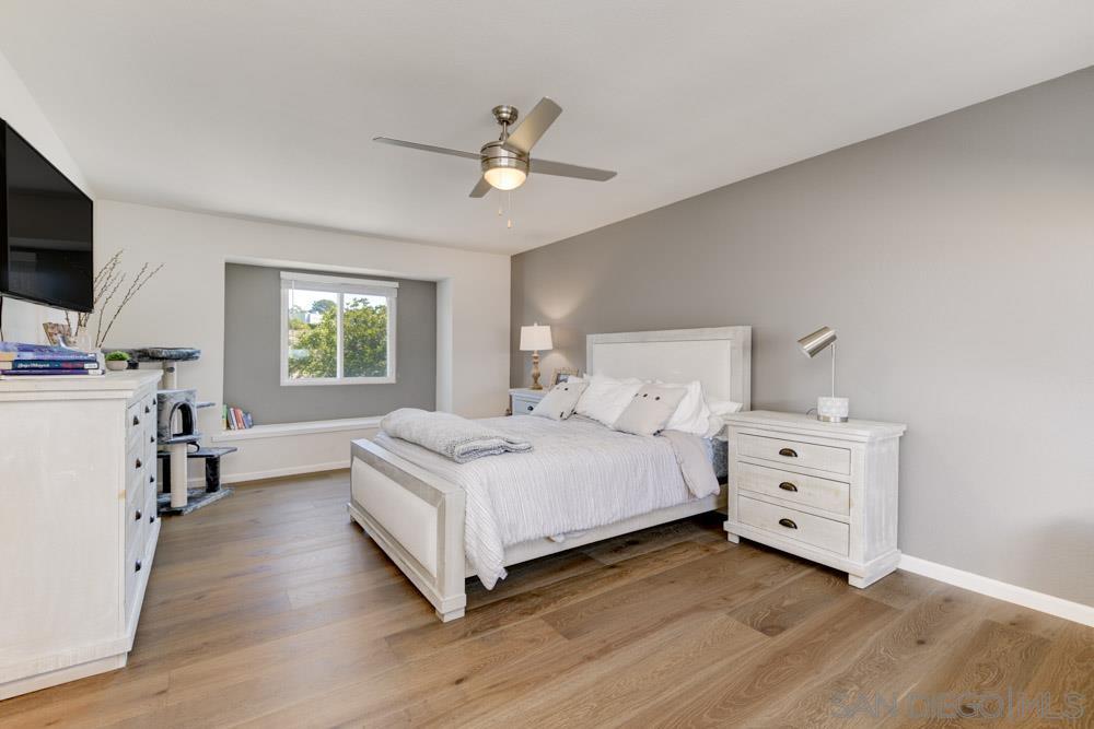807 Highland Drive Solana Beach, CA 92075 - Photo 16 of 27 a bedroom with a bed and a flat screen tv