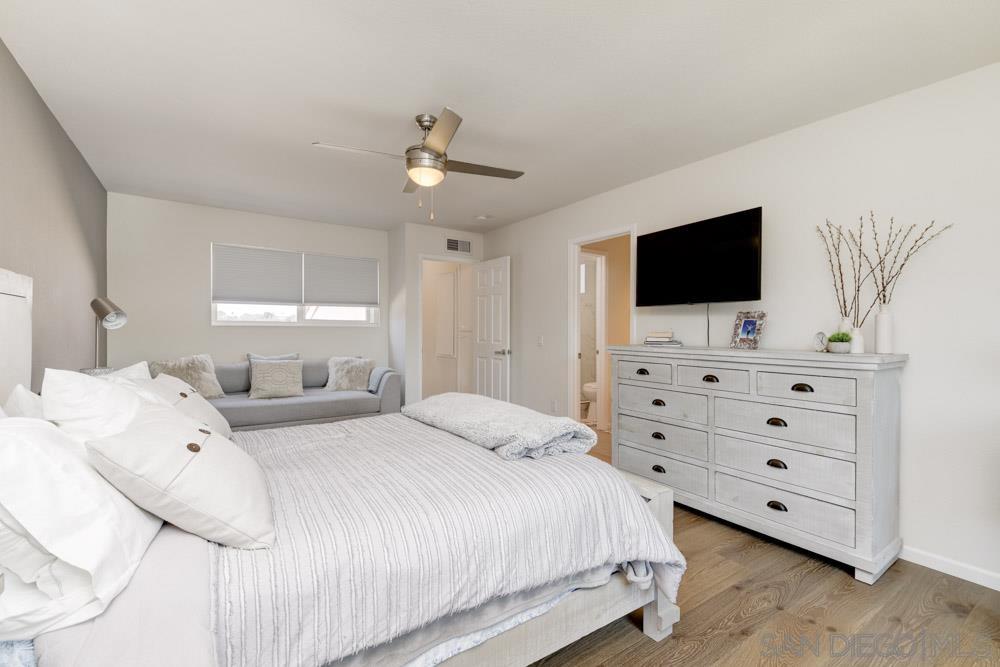 807 Highland Drive Solana Beach, CA 92075 - Photo 17 of 27 a bedroom with a bed and a flat screen tv