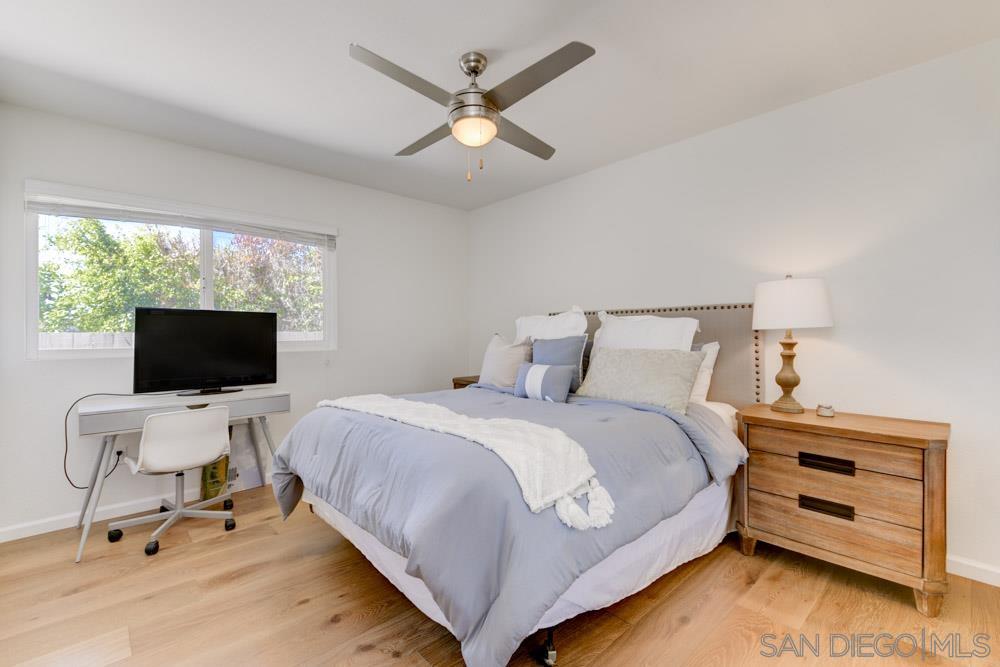 807 Highland Drive Solana Beach, CA 92075 - Photo 22 of 27 a bedroom with a bed and a flat screen tv