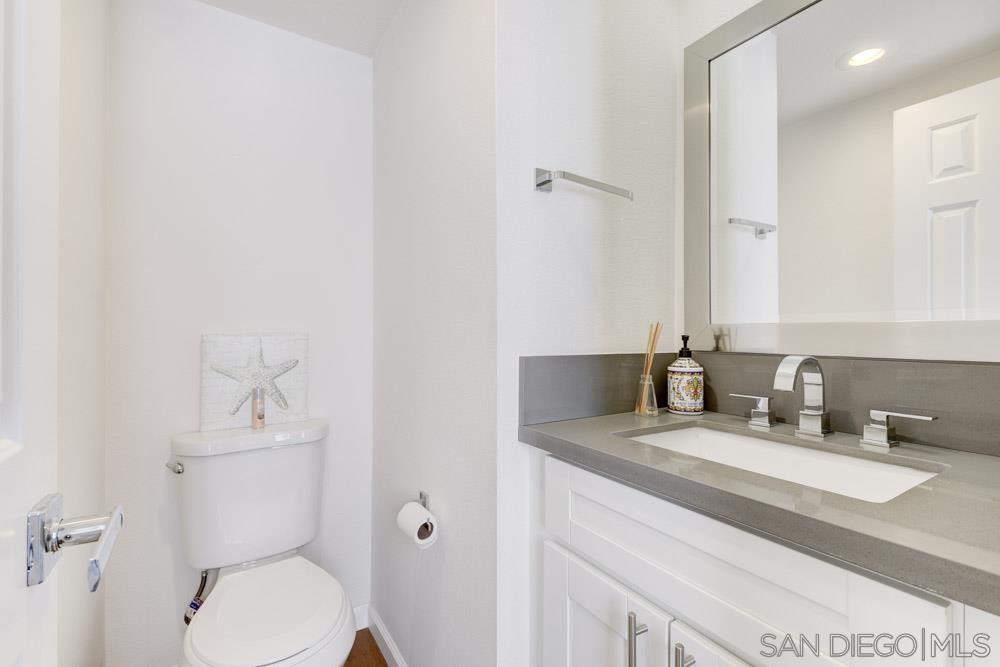 807 Highland Drive Solana Beach, CA 92075 - Photo 23 of 27 a bathroom with a sink toilet and a mirror