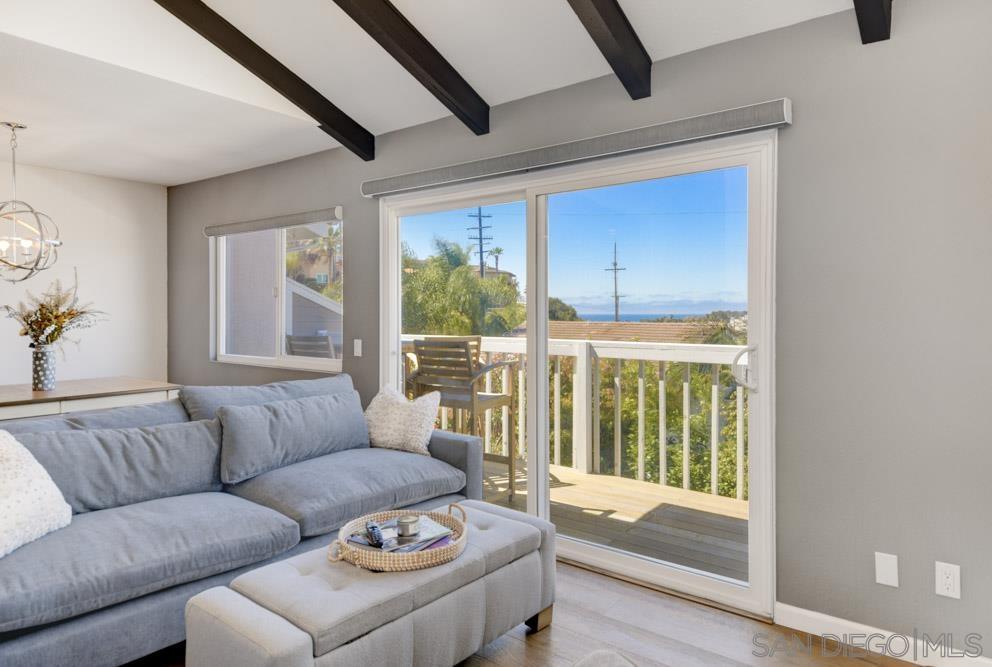 807 Highland Drive Solana Beach, CA 92075 - Photo 4 of 27 a living room with furniture and a large window
