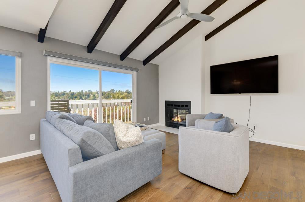 807 Highland Drive Solana Beach, CA 92075 - Photo 5 of 27 a living room with furniture and a flat screen tv