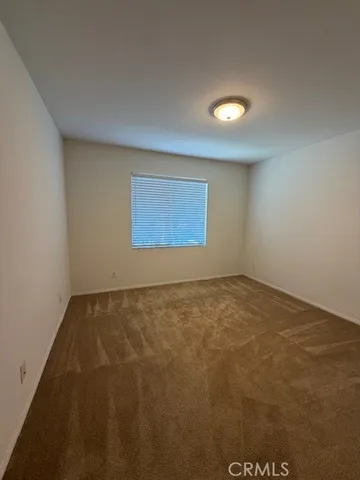 a spacious bathroom with a double vanity sink and a mirror