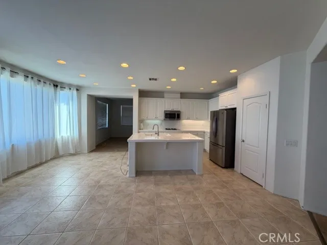 a view of a kitchen with a refrigerator in a kitchen