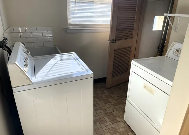 a utility room with dryer and washer