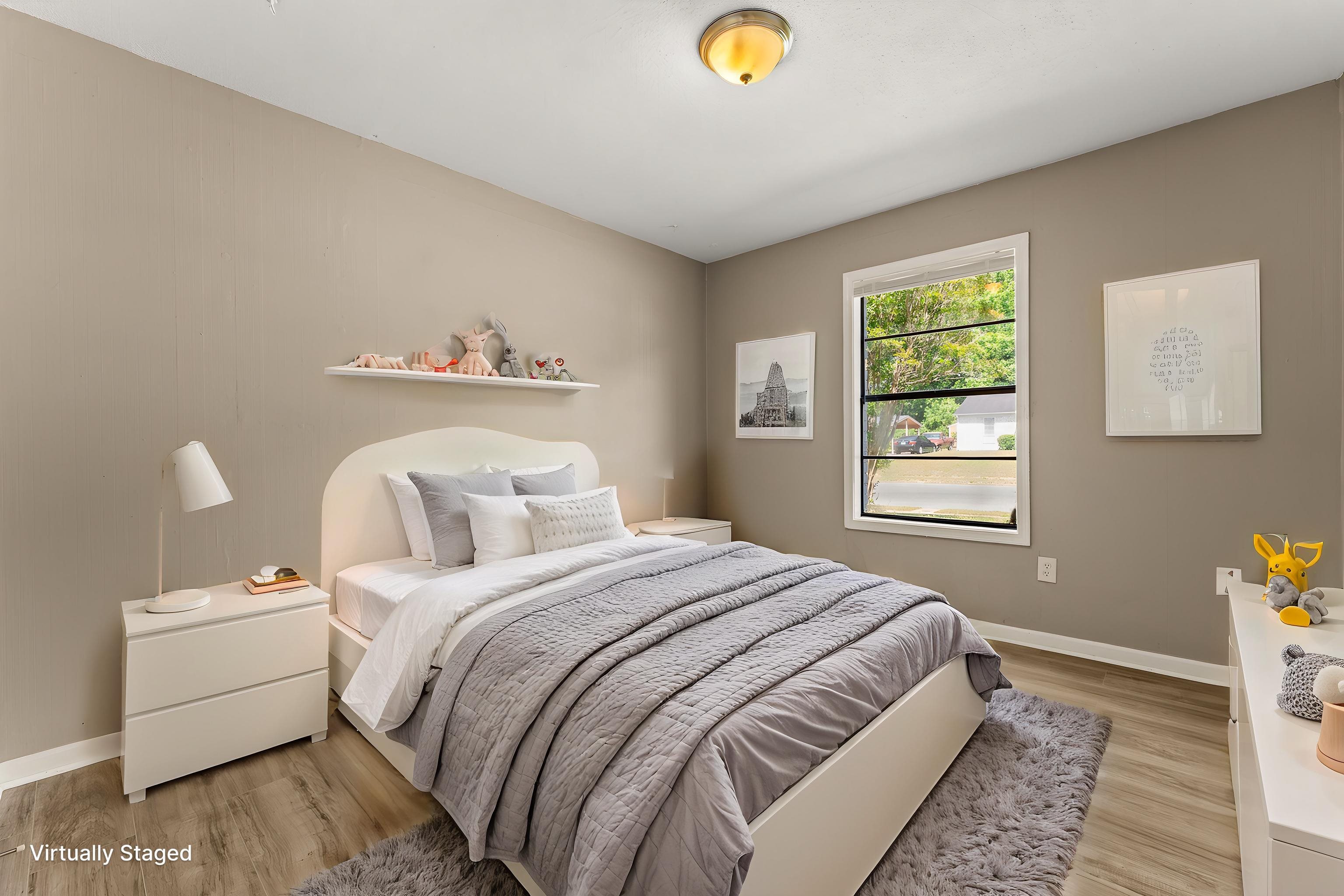 3759 McCain Road Memphis, TN 38109 - Photo 14 of 30 a bedroom with a bed and a window