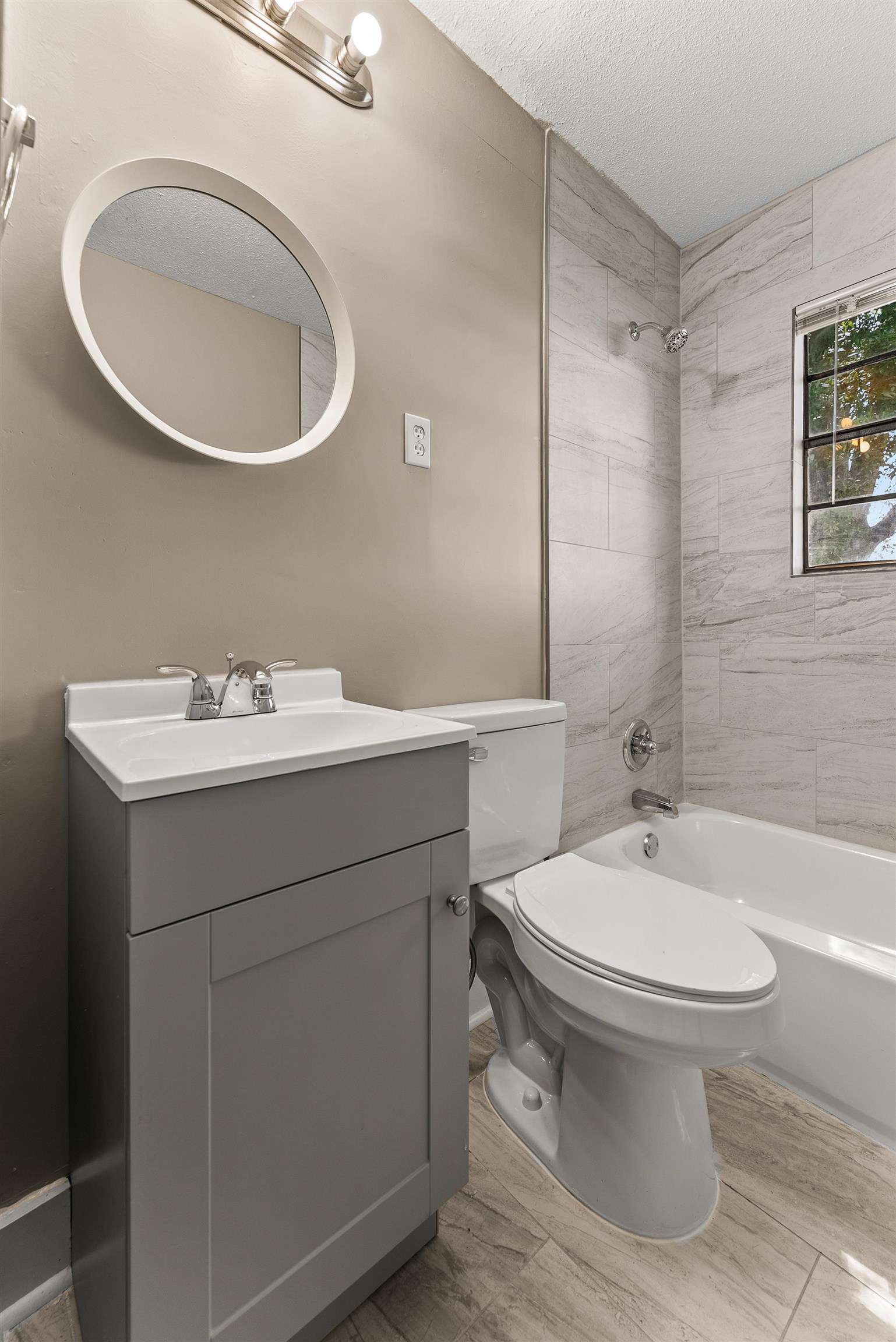 3759 McCain Road Memphis, TN 38109 - Photo 17 of 30 a bathroom with a sink a toilet and a mirror