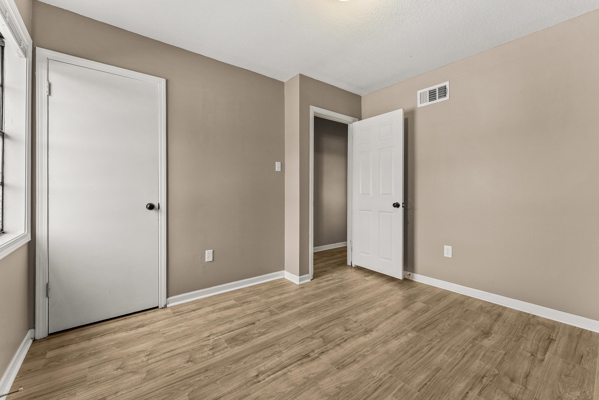 3759 McCain Road Memphis, TN 38109 - Photo 23 of 30 a view of an empty room with wooden floor