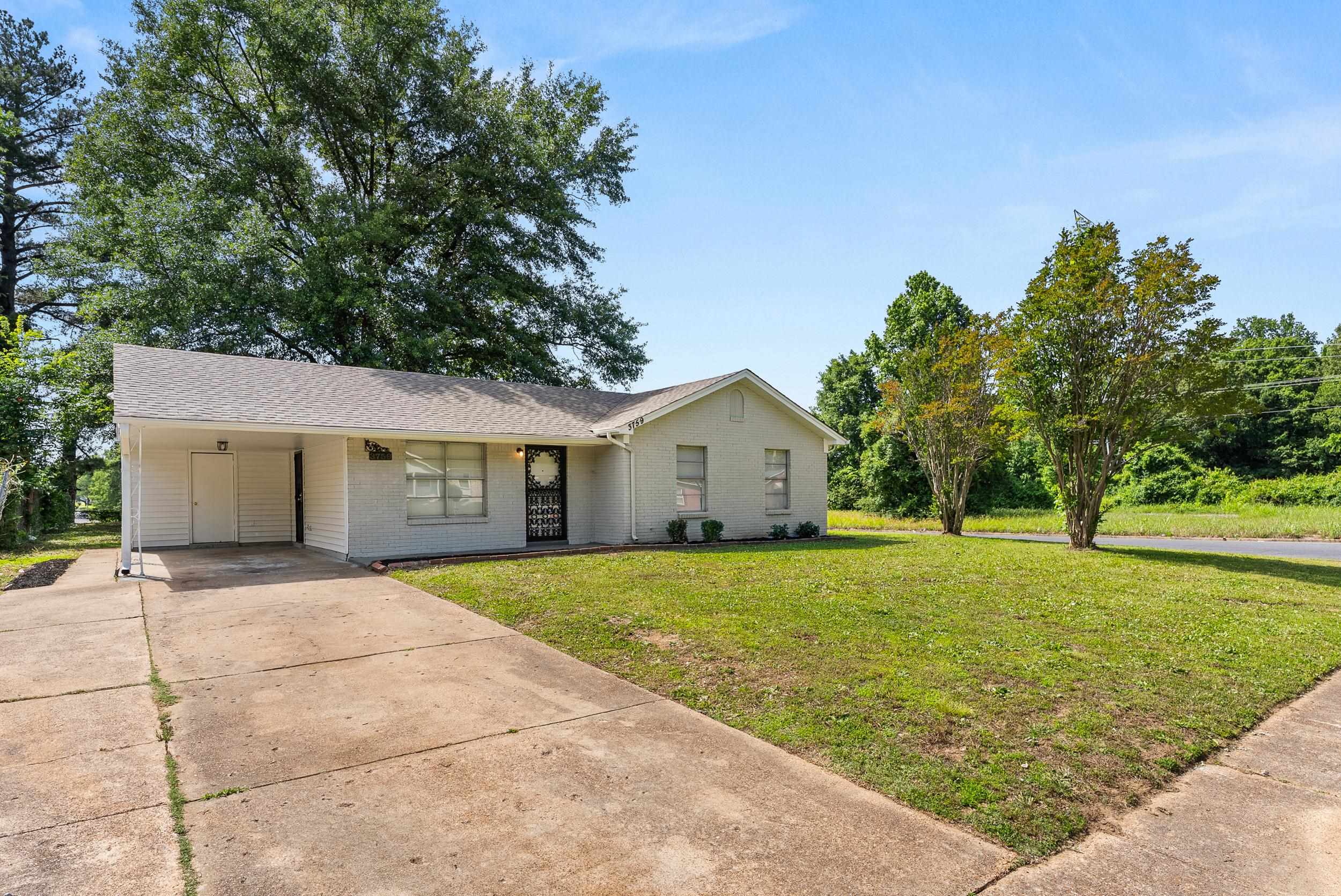 3759 McCain Road Memphis, TN 38109 - Photo 3 of 30 a front view of house with yard and trees
