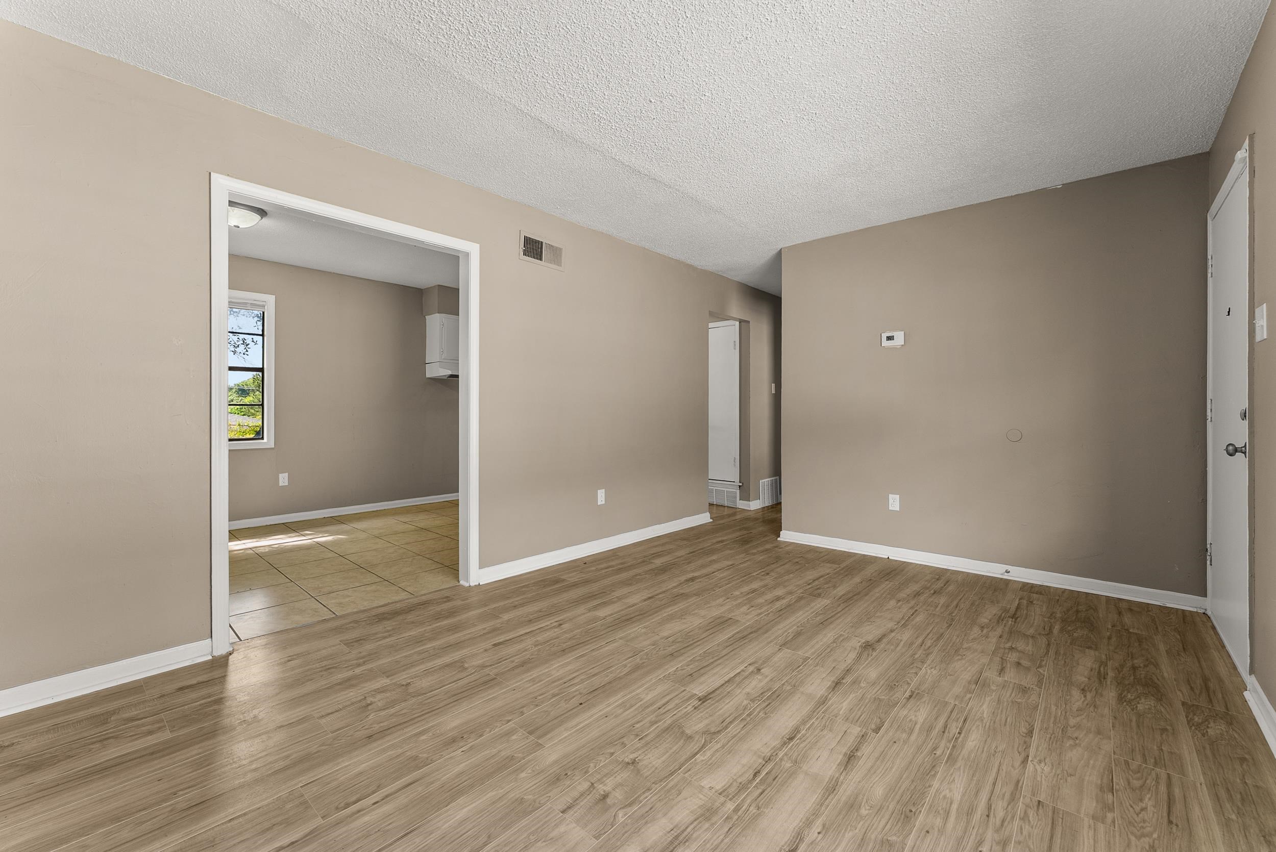 3759 McCain Road Memphis, TN 38109 - Photo 6 of 30 wooden floor in an empty room with a window
