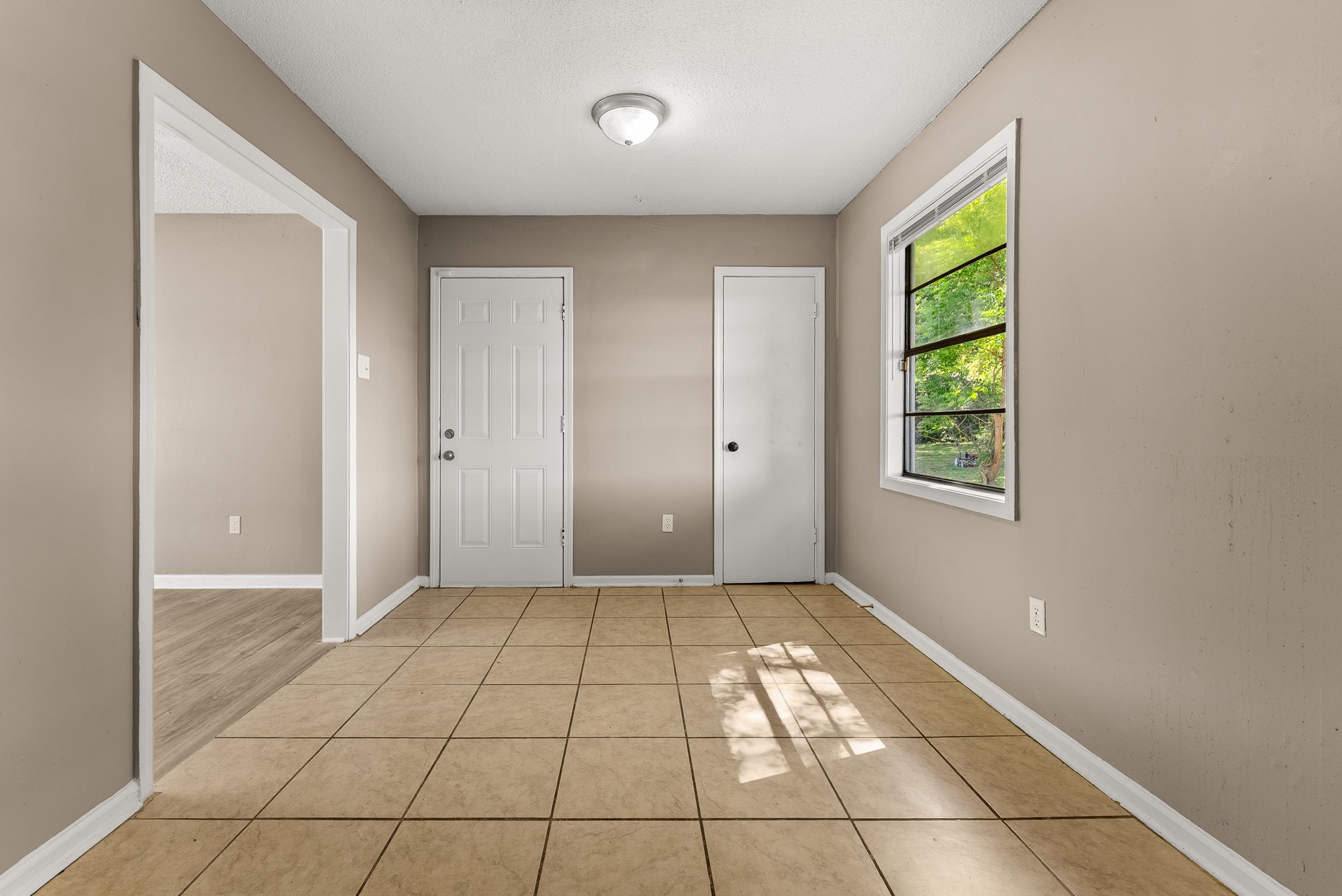 3759 McCain Road Memphis, TN 38109 - Photo 10 of 30 a view of an empty room with window and a bathroom