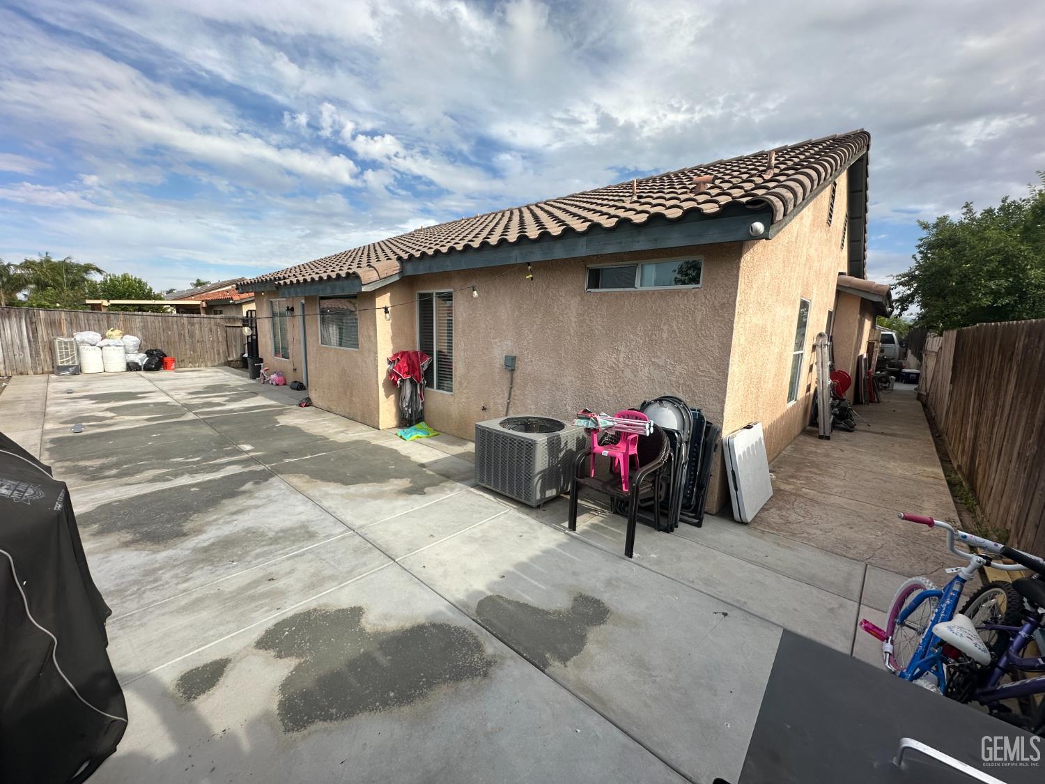 Undisclosed Address Bakersfield, CA 93307 - Photo 15 of 15 a view of a car park in front of house