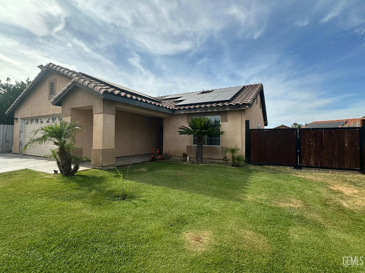 Undisclosed Address Bakersfield, CA 93307 - Photo 2 of 15 a house view with a garden space