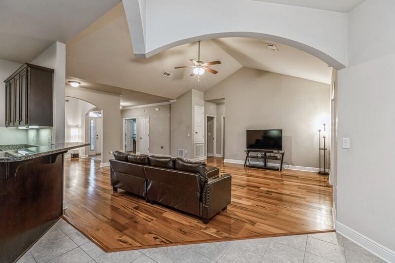 516 Pheasant Trail Crestview, FL 32536 - Photo 11 of 38 a living room with furniture and a flat screen tv