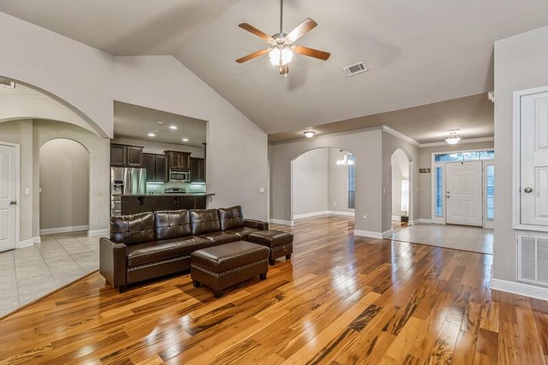 516 Pheasant Trail Crestview, FL 32536 - Photo 12 of 38 a living room with furniture and wooden floor
