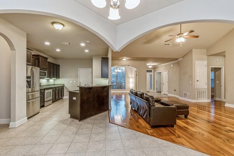 516 Pheasant Trail Crestview, FL 32536 - Photo 15 of 38 a large kitchen with stainless steel appliances granite countertop a large counter top a stove a chimney a sink and a refrigerator