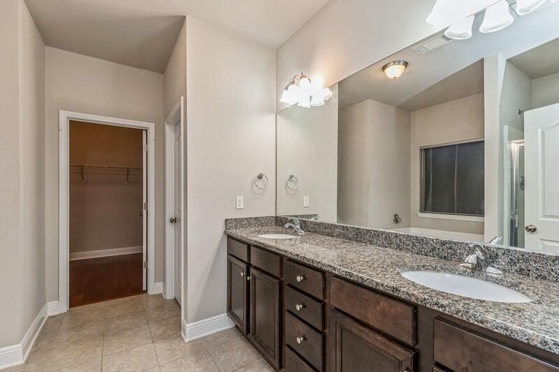 516 Pheasant Trail Crestview, FL 32536 - Photo 24 of 38 a bathroom with a granite countertop double vanity sink and a mirror