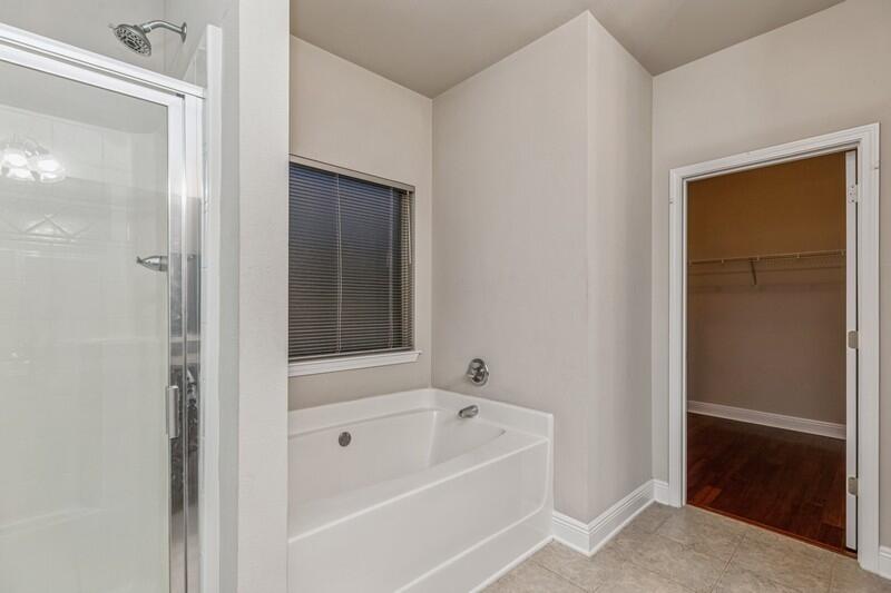 516 Pheasant Trail Crestview, FL 32536 - Photo 25 of 38 a bathroom with a bathtub and a shower