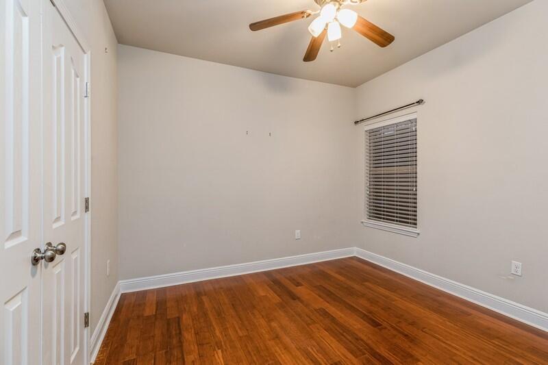 516 Pheasant Trail Crestview, FL 32536 - Photo 28 of 38 a view of an empty room with wooden floor and a window