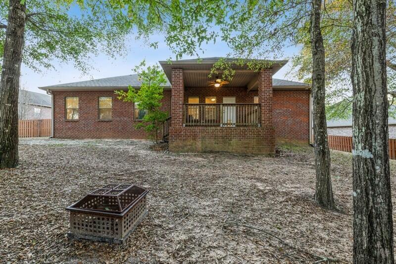 516 Pheasant Trail Crestview, FL 32536 - Photo 34 of 38 a backyard of a house with table and chairs