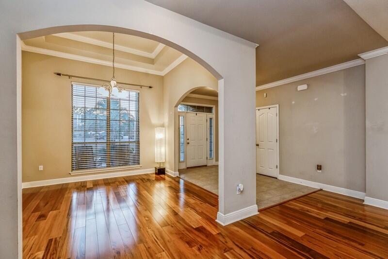 516 Pheasant Trail Crestview, FL 32536 - Photo 5 of 38 wooden floor in an empty room with a window
