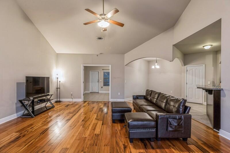 516 Pheasant Trail Crestview, FL 32536 - Photo 9 of 38 a living room with furniture and a flat screen tv