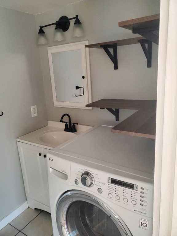 49 Hayden Pond Road, Unit 2 Dudley, MA 01571 - Photo 14 of 18 a utility room with dryer and washer