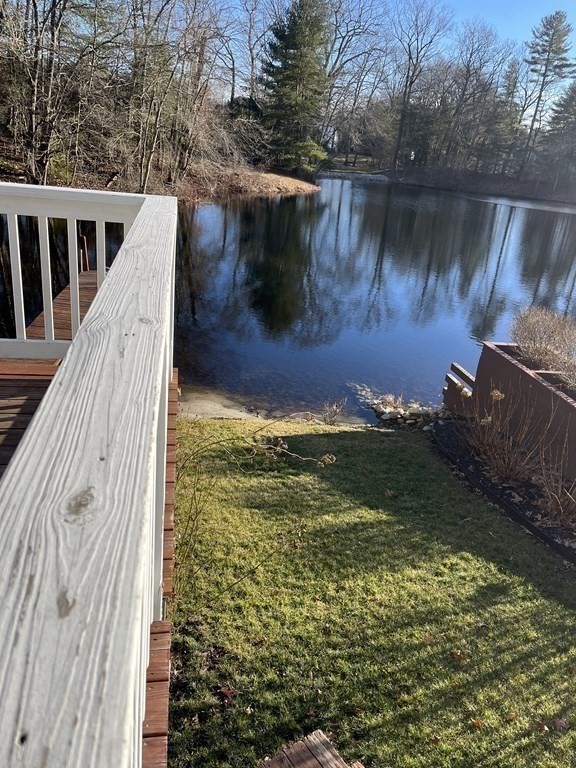 49 Hayden Pond Road, Unit 2 Dudley, MA 01571 - Photo 16 of 18 a view of a lake from a yard
