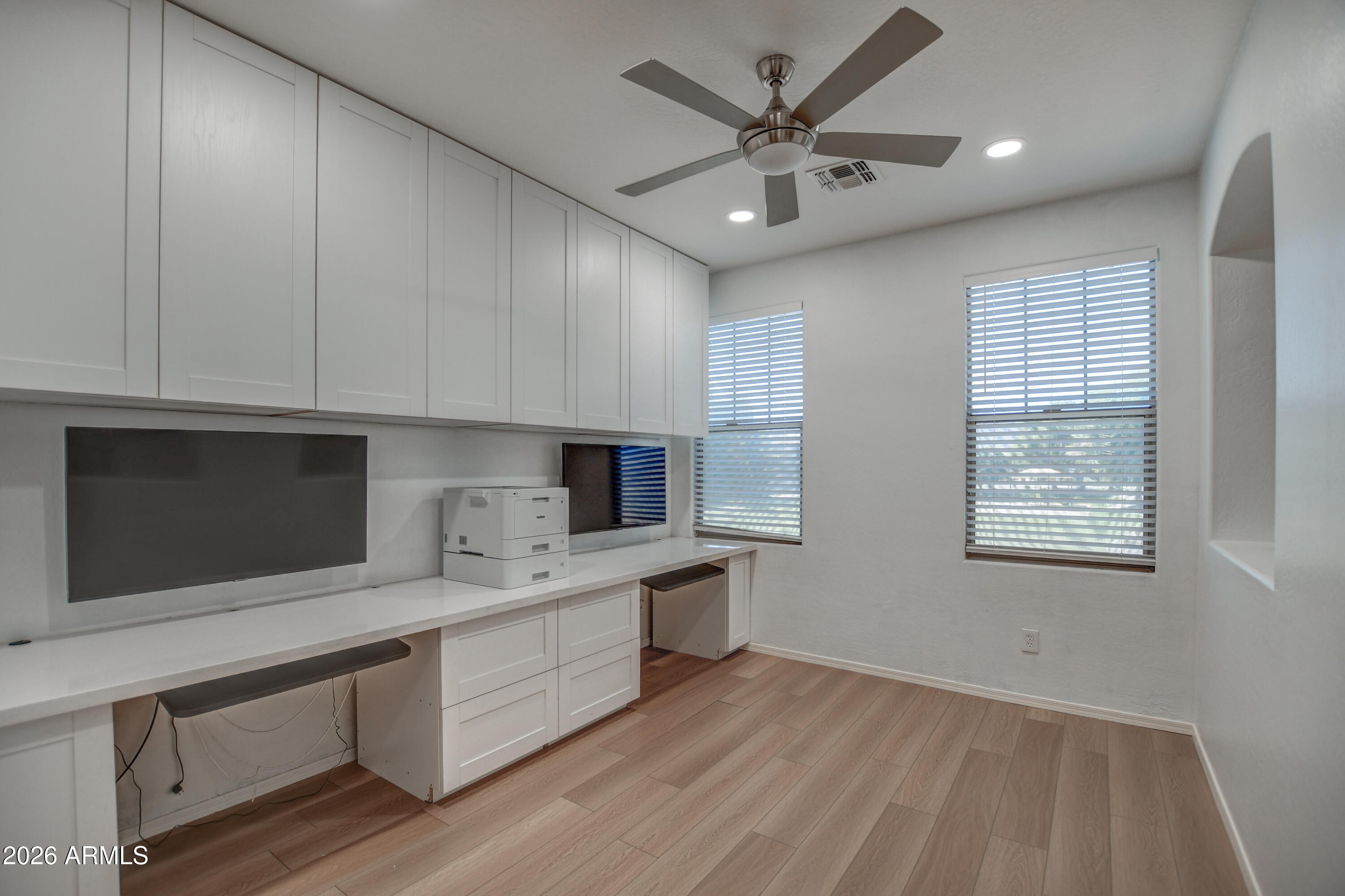 3078 East Muirfield Street Gilbert, AZ 85298 - Photo 58 of 92 a kitchen with stainless steel appliances kitchen island granite countertop a sink dishwasher a stove and a microwave oven with cabinets