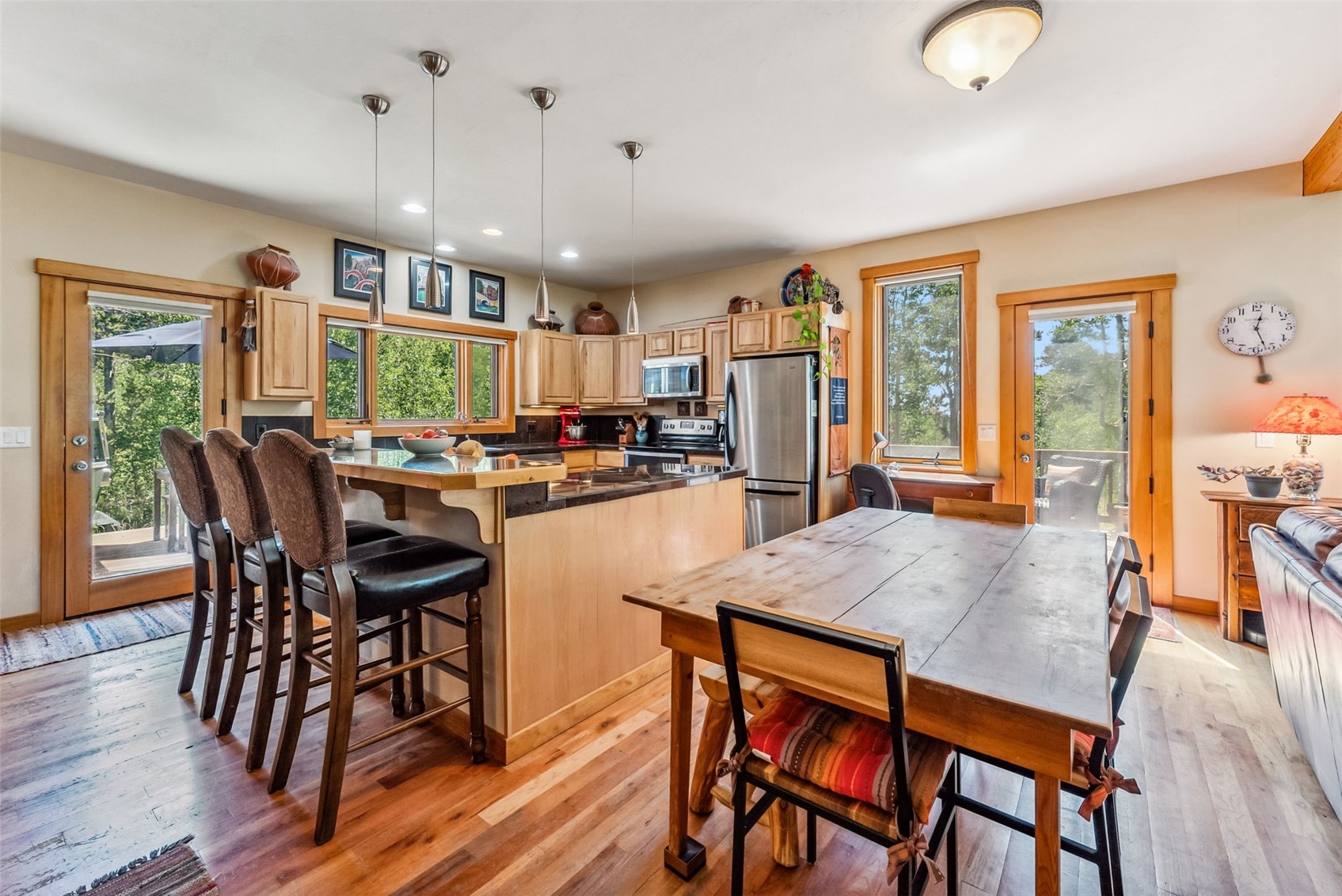 228 Glacier Ridge Road Alma, CO 80420 - Photo 11 of 50 a view of a dining room with furniture and wooden floor