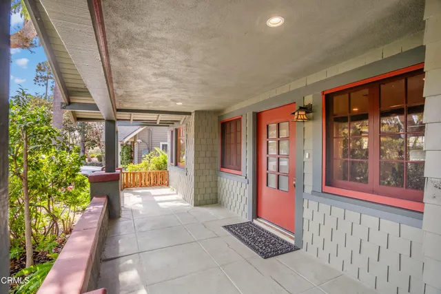 a living room with fireplace furniture and a chandelier