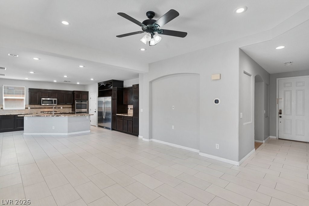 10336 Hawk Ravine Street Las Vegas, NV 89178 - Photo 6 of 59 Living Room looking towards the kitchen.