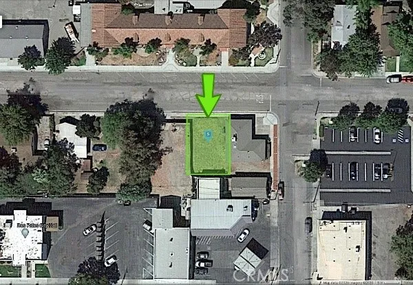 an aerial view of multiple houses with yard