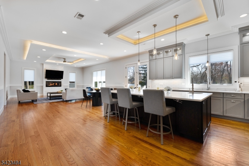 57 Walnut Street Livingston, NJ 07039 - Photo 12 of 43 a view of a dining room with furniture and wooden floor