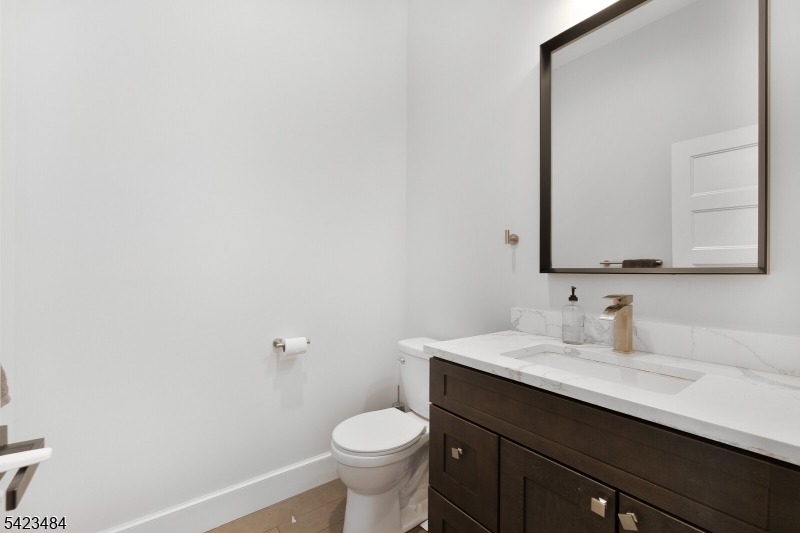 57 Walnut Street Livingston, NJ 07039 - Photo 19 of 43 a bathroom with a sink and a toilet