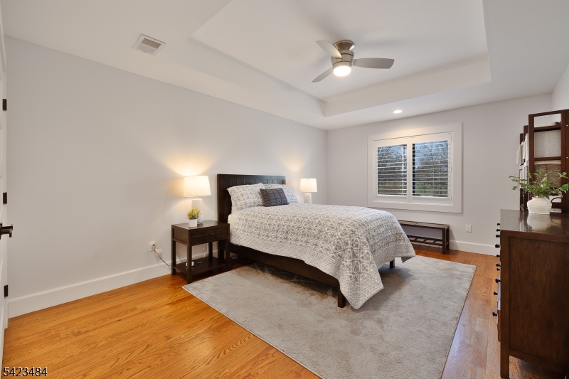57 Walnut Street Livingston, NJ 07039 - Photo 22 of 43 a bedroom with a bed and window