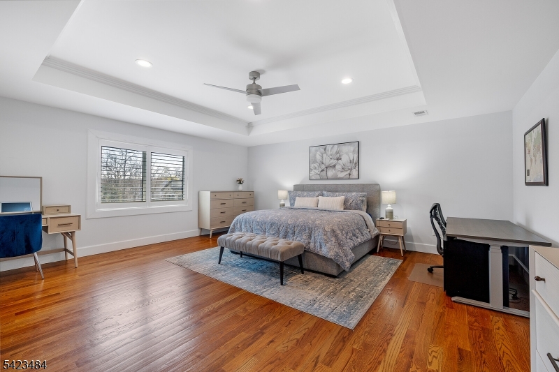 57 Walnut Street Livingston, NJ 07039 - Photo 24 of 43 a living room with a bed furniture and a window