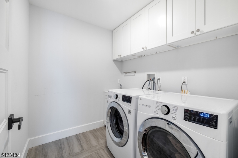 57 Walnut Street Livingston, NJ 07039 - Photo 31 of 43 a utility room with dryer and washer