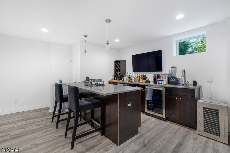 57 Walnut Street Livingston, NJ 07039 - Photo 35 of 43 a kitchen with a sink appliances and wooden floor