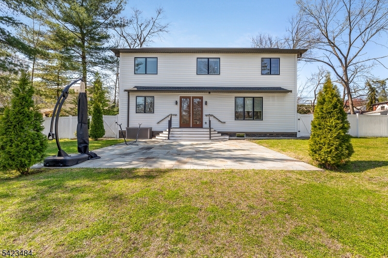57 Walnut Street Livingston, NJ 07039 - Photo 38 of 43 a house view with swimming pool in front of it