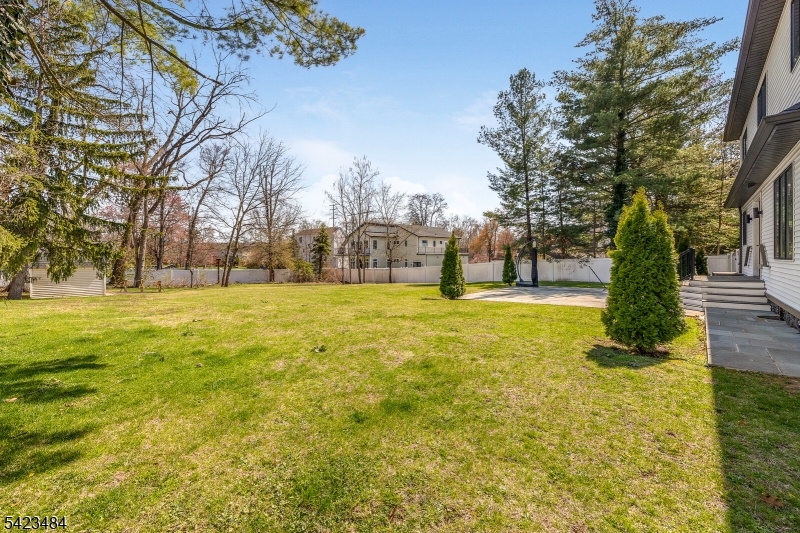 57 Walnut Street Livingston, NJ 07039 - Photo 40 of 43 a view of yard with swimming pool