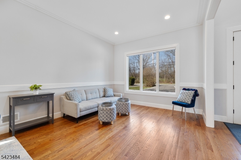 57 Walnut Street Livingston, NJ 07039 - Photo 5 of 43 a living room with furniture and wooden floor