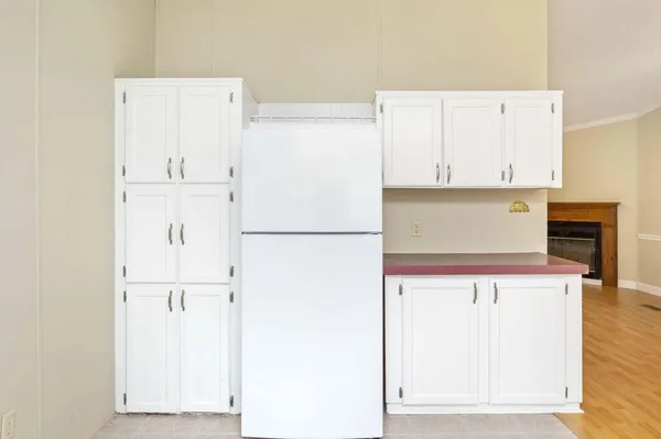 a view of kitchen with cabinets and wooden floor