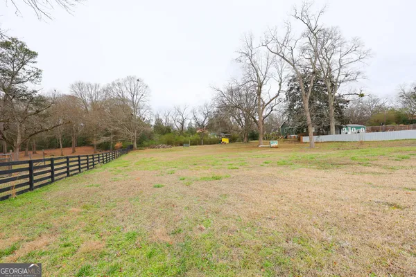 a view of a swimming pool with an outdoor space and seating area