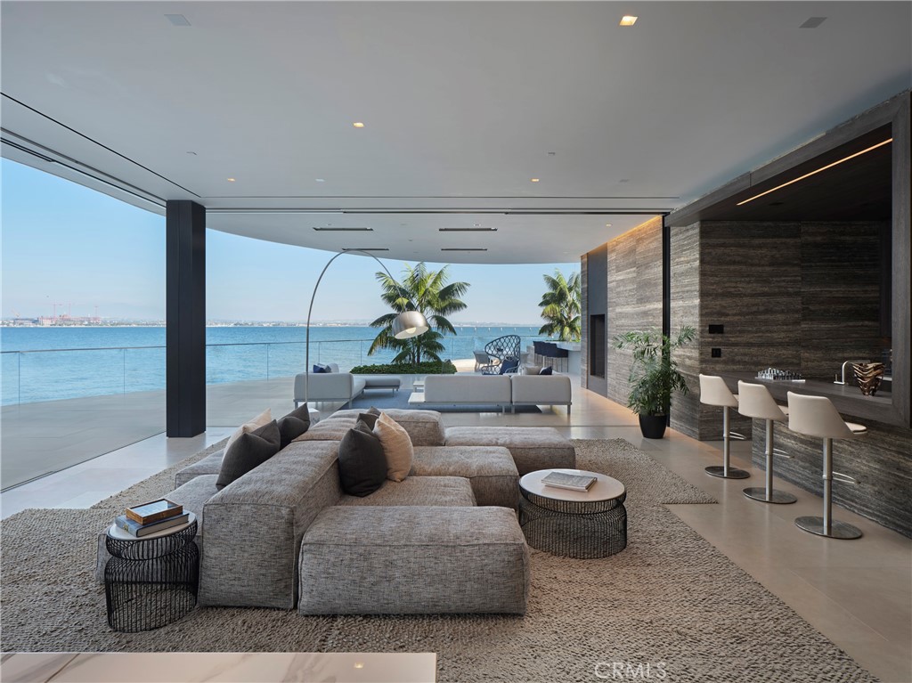 3 The Point Coronado, CA 92118 - Photo 17 of 53 a living room with furniture and a floor to ceiling window