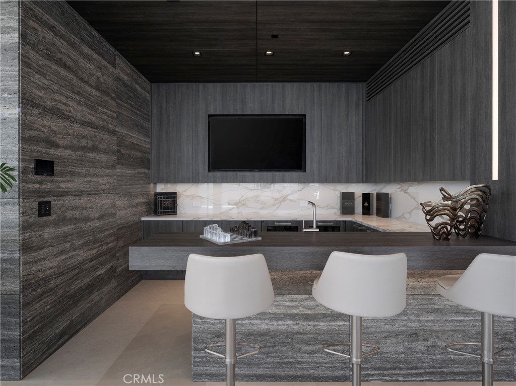 3 The Point Coronado, CA 92118 - Photo 18 of 53 a living room with furniture a flat screen tv and kitchen view