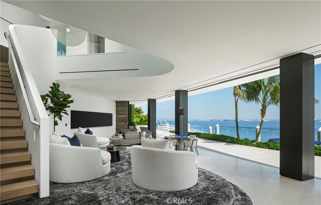 3 The Point Coronado, CA 92118 - Photo 3 of 53 a living room with furniture and a large window